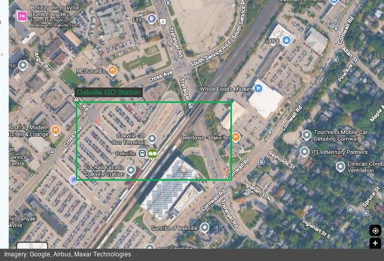 Satellite view of Oakville GO Station and the rail corridor, showing the station platforms and surrounding Midtown area